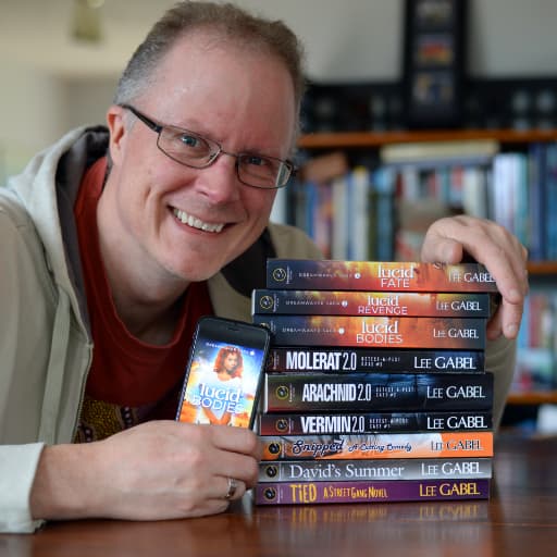 Lee with a stack of his most recent paperback novels. He proud of the novels he's written.