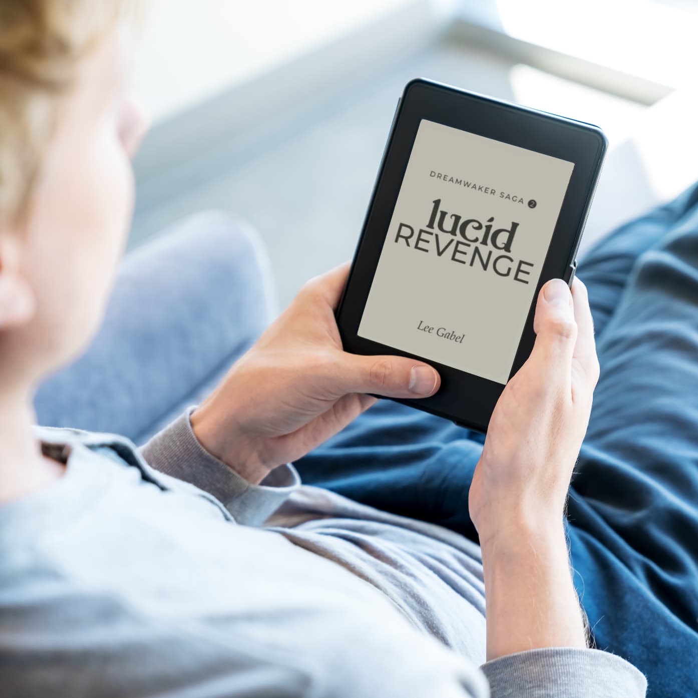 Person relaxing and reading Lucid Revenge on an e-reader.